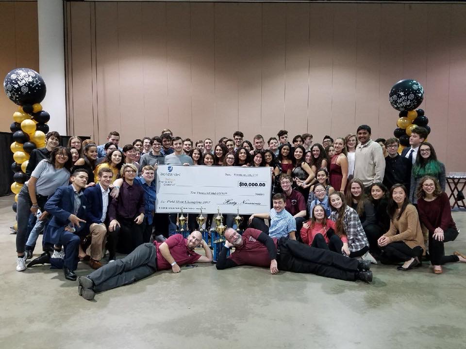 NHS marching band poses for a picture with the check, photo: Nutley Music Boosters website