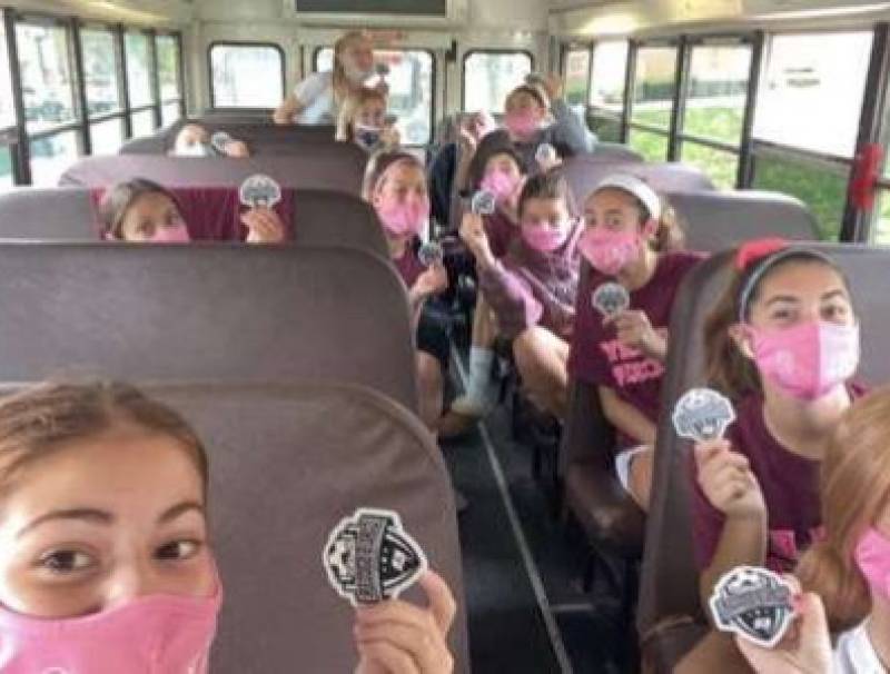 Nutley Girls Soccer team masked up, each sitting in their own row on the bus to ensure safety.