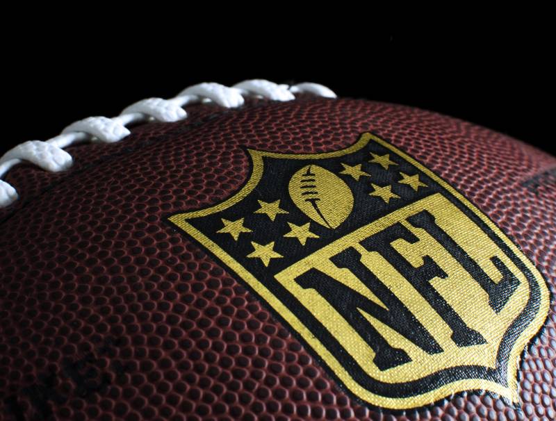 The NFL official football, showcasing the logo 
