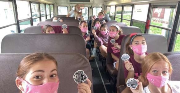 Nutley Girls Soccer team masked up, each sitting in their own row on the bus to ensure safety.