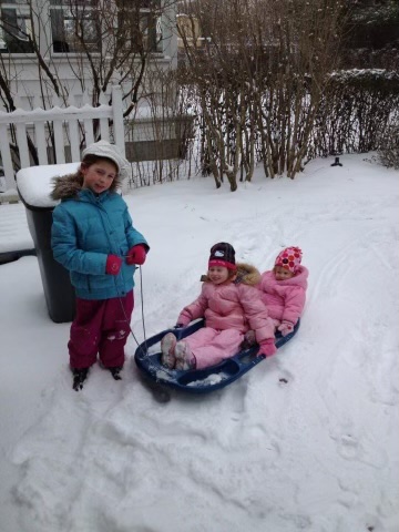My sisters and I playing in the snow when we were younger on a snowday. 