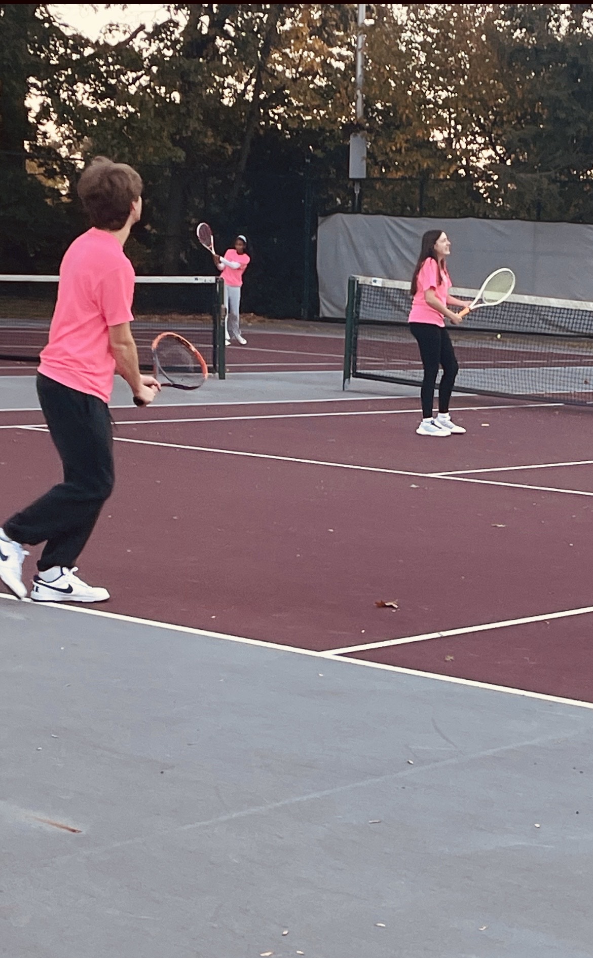 Juniors Alexis Rodriguez  and Noah Balsiak  acing the courts during the Servathon.