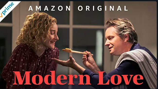 A man feeds a woman spaghetti on a wooden spoon. The words Amazon Original can be seen at the top, while the words Modern Love are seen at the bottom.