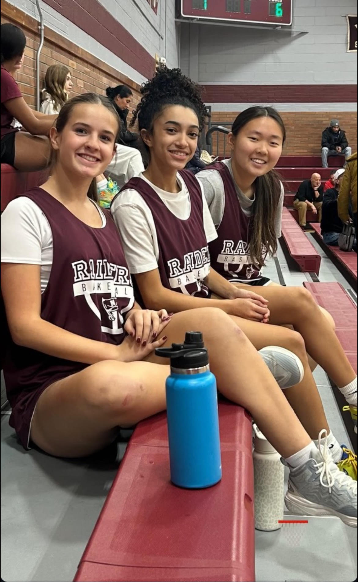 Valdez and friends, seated in basketball uniforms