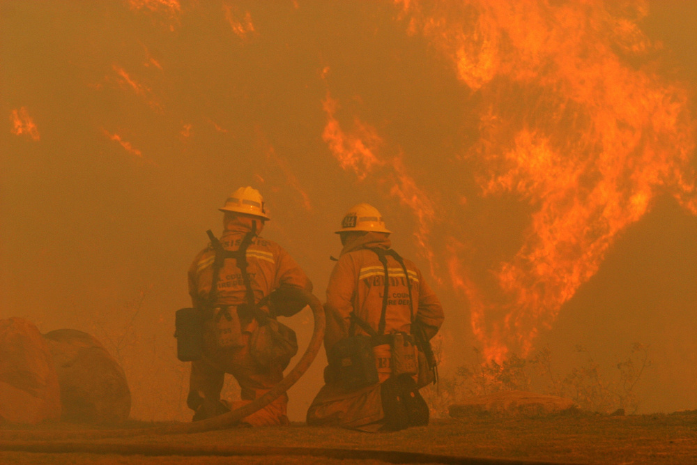 Firefighters combat the flames 