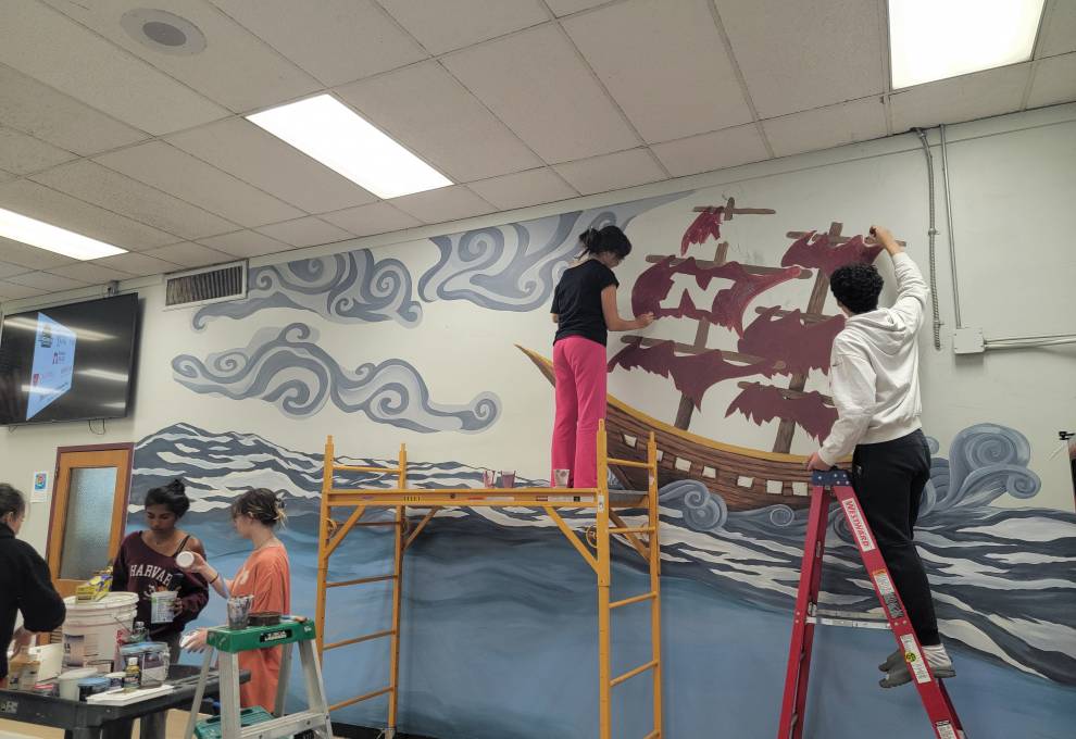 Art Students Work On The Mural