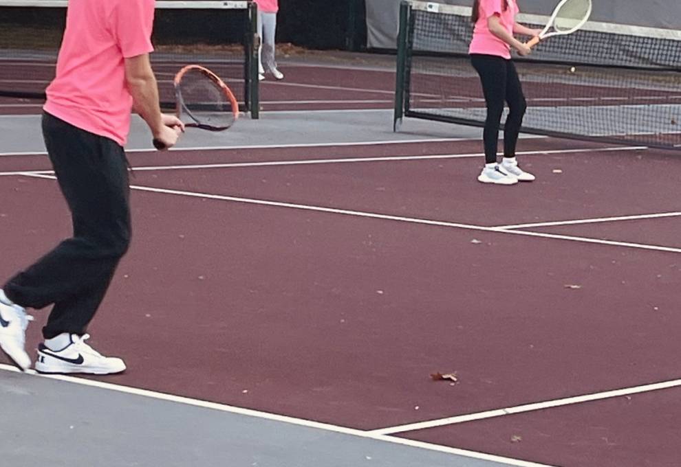 Juniors Alexis Rodriguez  and Noah Balsiak  acing the courts during the Servathon. 