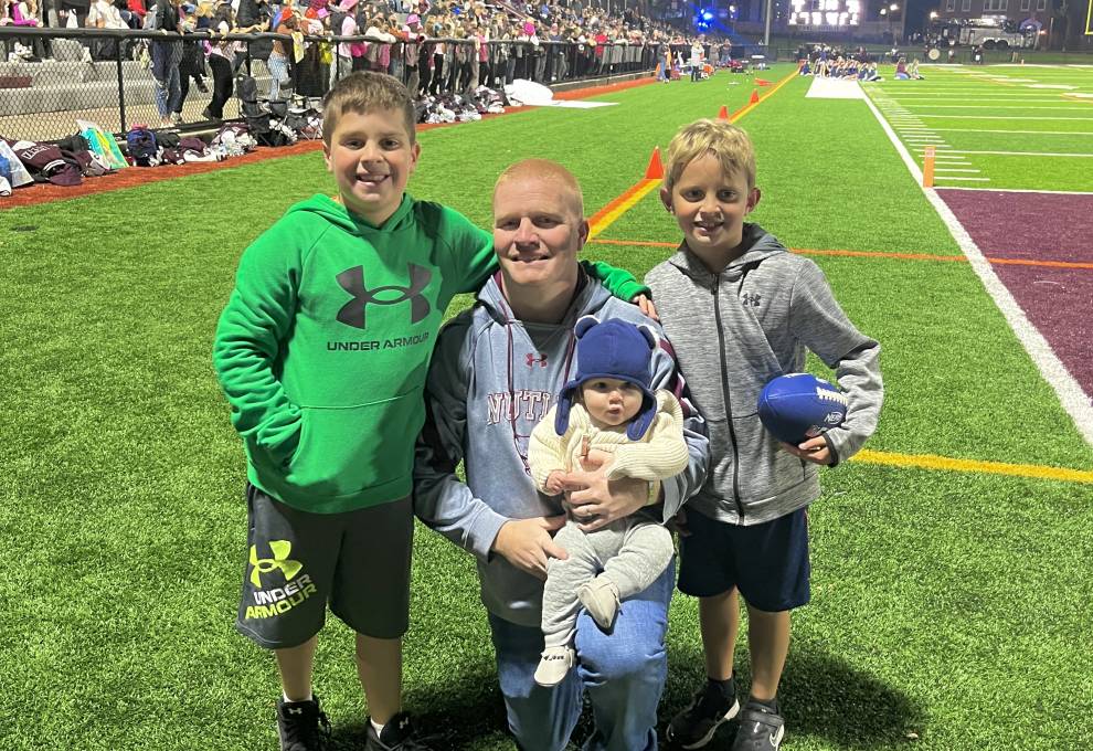 Jandoli and his children, Devin, Connor, and Noah, attending the NHS Varsity Senior Night football game at the Nutley Park Oval