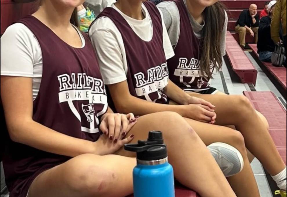 Valdez and friends, seated in basketball uniforms