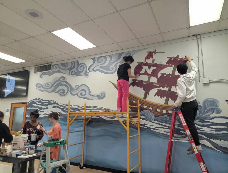 Art Students Work On The Mural