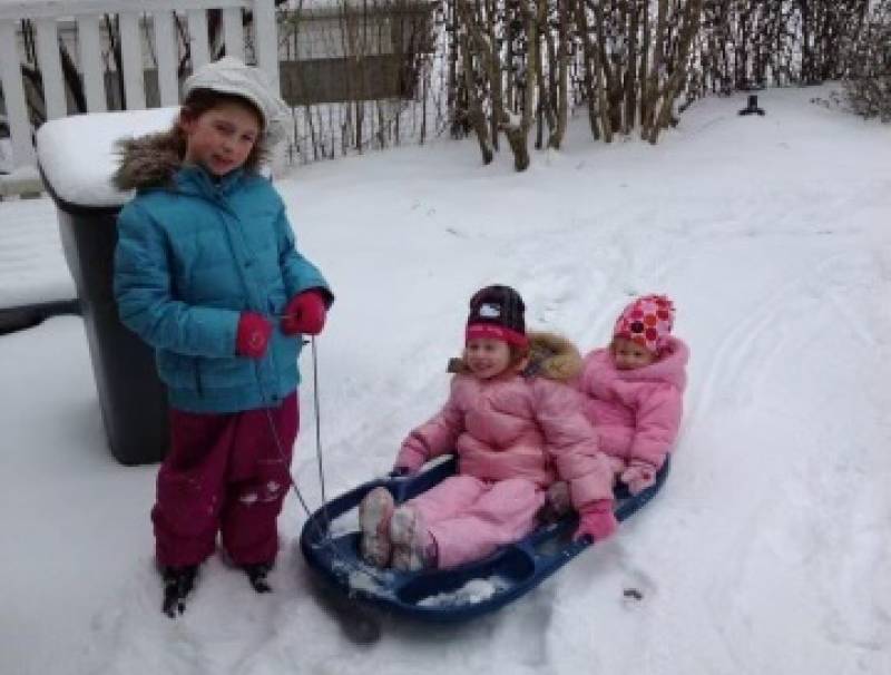 My sisters and I playing in the snow when we were younger on a snowday. 
