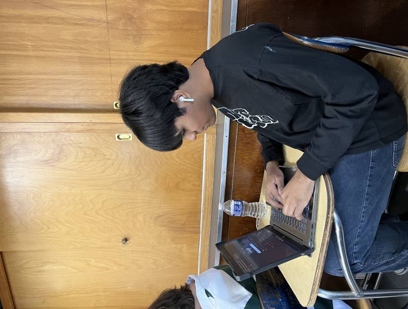 Sophomore Kardan Ferreira doing school work on his Chromebook. 
