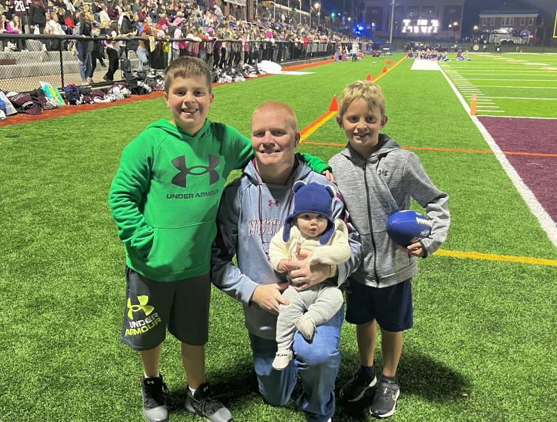 Jandoli and his children, Devin, Connor, and Noah, attending the NHS Varsity Senior Night football game at the Nutley Park Oval
