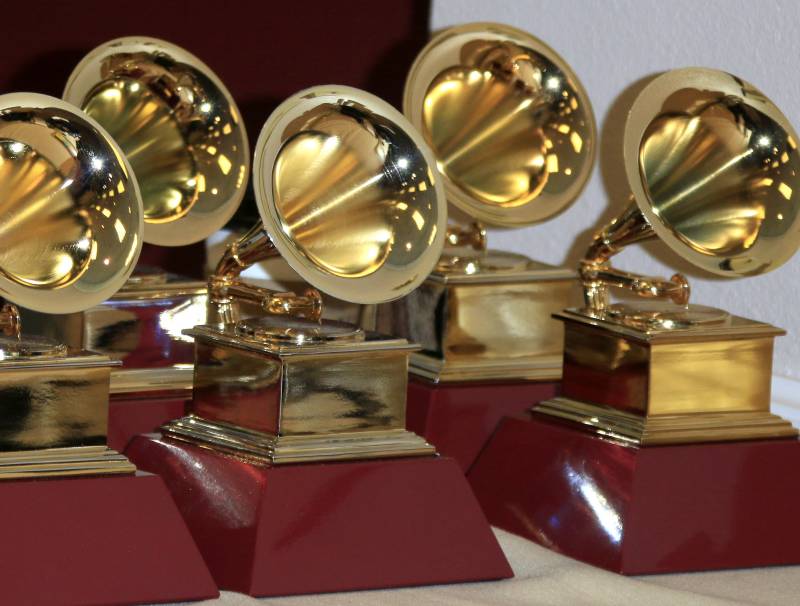 a picture of the grammy awards given to the winning  nominees 